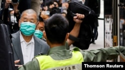 FILE PHOTO: Media mogul Jimmy Lai, founder of Apple Daily, leaves the Court of Final Appeal by prison van in Hong Kong