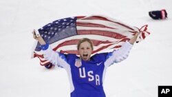 Jocelyne Lamoureux-Davidson of the United States celebrates after winning the women's gold medal hockey game at the 2018 Winter Olympics in Gangneung, South Korea, Feb. 22, 2018.