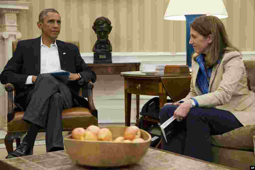 President Barack Obama meets Health and Human Services Secretary Sylvia Burwell and other members of his public health and national security team to discuss the response to the diagnosis of a second Ebola in the U.S., in the Oval Office of the White House, Oct. 13, 2014.