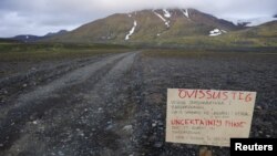 A warning sign blocks the road to Bardarbunga volcano, some 20 kilometers (12.5 miles) away, in the north-west region of the Vatnajokull glacier Aug. 19, 2014.