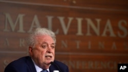 FILE - Argentina's Health Minister Gines Gonzalez Garcia gives a press conference in Buenos Aires, Dec. 24, 2020. Gonzalez Garcia's resignation was sought Feb. 19, 2021, after he reportedly gave preferential treatment to some seeking COVID vaccines.