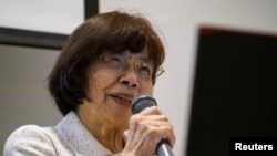 Atomic bomb survivor Teruko Yahata speaks to foreign visitors in Hiroshima