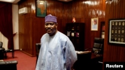 FILE - Hama Amadou poses for a picture at his office in the National Assembly in Niamey, Niger.