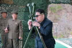 FILE - North Korean leader Kim Jong Un focuses on the underwater test-fire of a strategic submarine ballistic missile in this undated photo released by North Korea's Korean Central News Agency in Pyongyang, April 24, 2016.