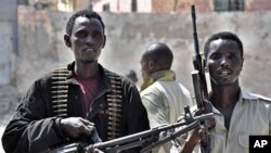 Somalia government policemen guard a street in southern Mogadishu during a raid in which 60 people suspected of creating violence in the capital were arrested (File)