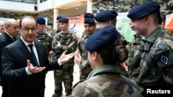 French President Francois Hollande speaks to young soldiers at the military school of Saint-Cyr-Coetquidan in Guer, Jan. 14, 2016.