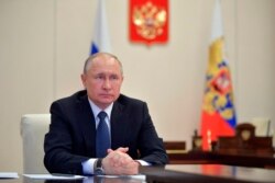 FILE - Russian President Vladimir Putin is seen during a meeting at the Novo-Ogaryovo residence outside Moscow, Russia, April 7, 2020.