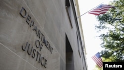 FILE - The exterior of the U.S. Department of Justice headquarters building is seen in Washington, July 14, 2009.