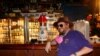 FILE - Bill Hasselback, owner of the Leon Pub in Tallahassee, Fla., says bars have been treated unfairly during the coronavirus outbreak. Florida Governor Ron DeSantis said Sept. 25, 2020, that the state would lift restrictions on bars.