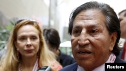 Former Peru's President Alejandro Toledo and his wife Eliane Karp arrives to the 2015 IMF/World Bank Annual Meetings in Lima, Peru, Oct. 8, 2015.