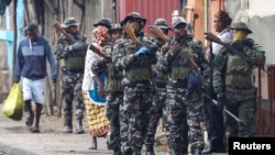 FILE - Members of the Mozambique military patrol the streets of the capital amid violence sparked by the election outcome, in Maputo, Mozambique, Nov. 8, 2024. Tens of thousands of Mozambicans have fled the country to escape the political unrest. 
