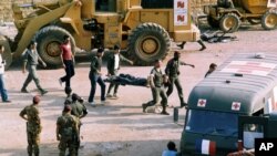 FILE - The scene at the U.S. Marine base near Beirut airport, Lebanon, following a suicide truck blast that destroyed the base and caused a huge death toll, Sunday, Oct. 23, 1983.