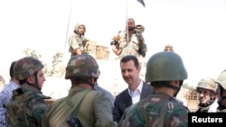 handout photograph distributed by Syria's national news agen