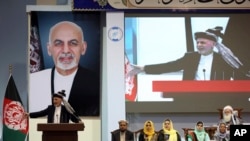 FILE - Afghan President Ashraf Ghani speaks on the last day of the Afghan loya jirga meeting in Kabul, Afghanistan, May 3, 2019. 