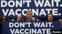 FILE - New York City Mayor Bill de Blasio speaks during a news conference declaring a public health emergency in parts of Brooklyn in response to a measles outbreak, requiring unvaccinated people living in the affected areas to get the vaccine or face fin