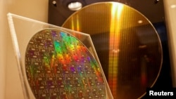 FILE PHOTO: Two chips are on display at the Taiwan Semiconductor Research Institute (TSRI) in Hsinchu