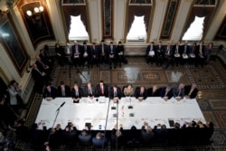 FILE - U.S. Trade Representative Robert Lighthizer, Treasury Secretary Steven Mnuchin, and other U.S. officials meet with China's Vice Premier Liu He and other Chinese officials in Washington, Feb. 21, 2019.