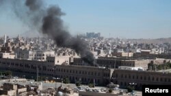 Smoke rises from the Defense Ministry's compound after an attack, in Sanaa, Dec. 5, 2013.