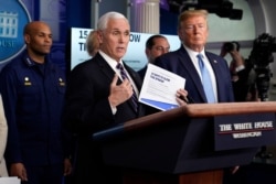 FILE - Vice President Mike Pence speaks as President Donald Trump listens during a press briefing with the coronavirus task force, at the White House, March 16, 2020, in Washington.