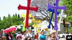 FILE - Many opponents of homosexuality say being gay is anti-Christian… But many gays, including these protesting in South Africa, say they’re Christians as well.