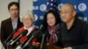 Family members watch as Kenneth Bae, right, freed during a top-secret mission, talks to reporters after he arrived at Joint Base Lewis-McChord, Washington, Nov. 8, 2014.