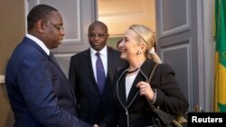 Hillary Clinton meets with Senegal's President Macky Sall at the Presidential Palace in Dakar August 1, 2012.