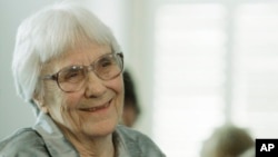 FILE - Author Harper Lee smiles during a ceremony at the state capitol in Montgomery, Alabama, Aug. 20, 2007.