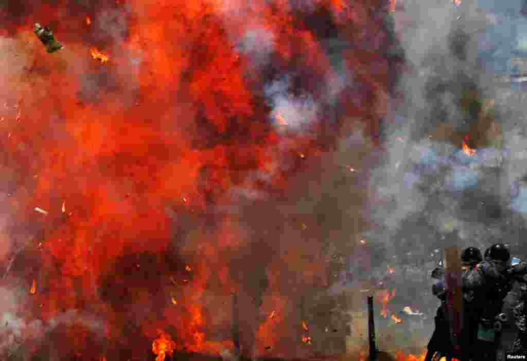Flames erupt as clashes break out while the Constituent Assembly election is being carried out in Caracas, Venezuela, July 30, 2017.
