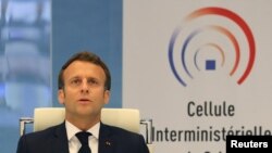 FILE - French President Emmanuel Macron takes part in a videoconference in Paris, France, May 13, 2020. 