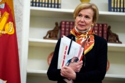 White House coronavirus response coordinator Dr. Deborah Birx listens during an event in the Oval Office of the White House, May 6, 2020, in Washington.