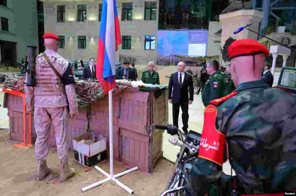 Russian Sgt. Vadim Shishimarin listens to his translator during a court hearing in Kyiv, Ukraine. The 21-year old soldier facing the first war crimes trial since the start of the war in Ukraine, plead guilty on May 18 to killing an unarmed civilian.
