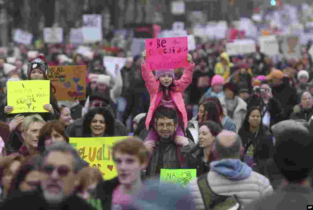 A young girl holds a protest sign as she participates in a Women's March Saturday Jan. 21, 2017 in Philadelphia. The march is being held in solidarity with similar events taking place in Washington and around the nation.(AP Photo/Jacqueline Larma)