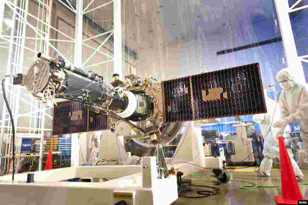 The fully integrated spacecraft and science instrument for NASA's Interface Region Imaging Spectrograph (IRIS) mission is seen in a clean room at the Lockheed Martin Space Systems Sunnyvale, California facility. (NASA/Lockheed Martin)