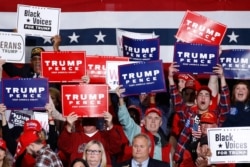 FILE - Supporters cheer as U.S. President Donald Trump speaks during a campaign rally, February 28, 2020, in North Charleston, South Carolina.