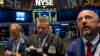 Traders work on the floor of the New York Stock Exchange, Oct. 15, 2014.