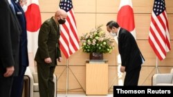 Commandant of the Marine Corps of the U.S. General David H. Berger meets with Japan's Prime Minister Yoshihide Suga in Tokyo, Nov. 18, 2020.
