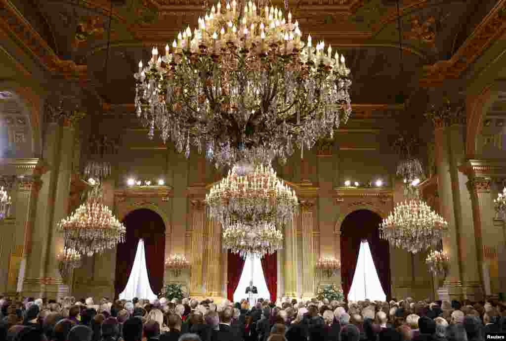 Belgium's King Philippe (back C) delivers a speech during a traditional new year reception for international institutions' representatives, government members and business leaders at the Brussels Royal Palace.