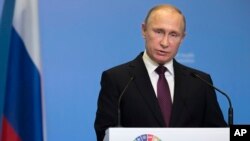 FILE - Russian President Vladimir Putin delivers his speech attending the World Health OrganiZation ministerial conference in Moscow, Russia, Nov. 16, 2017. 