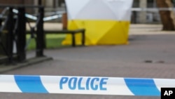 FILE - A police tent covers the spot in Salisbury, Britain, March 6, 2018, where former Russian double agent Sergei Skripal and his daughter Yulia were found critically ill following, as was later determined, their exposure to Soviet-era nerve agent Novichok.