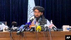 Taliban spokesman Zabihullah Mujahid speaks at at his first news conference in Kabul, Afghanistan, Tuesday, Aug. 17, 2021. On Tuesday he said the insurgents sought no revenge and that “everyone is forgiven.” (AP Photo/Rahmat Gul)