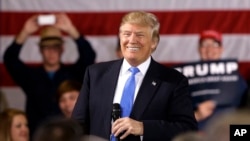 Republican presidential candidate Donald Trump smiles as he speaks at a campaign stop Tuesday, March 29, 2016.