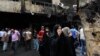Iraqi women wait to hear about family members who went missing after a truck bomb hit Karrada, a busy shopping district in the center of Baghdad, Iraq, July 3, 2016. 