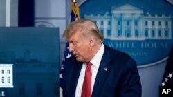 FILE - President Donald Trump leaves a news conference in the James Brady Press Briefing Room at the White House, in Washington, Aug. 10, 2020.