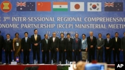 FILE - Trade ministers of 16 countries from the Asia-Pacific region stand for a photo at the Regional Comprehensive Economic Partnership ministerial meeting in Hanoi, May 22, 2017. The ministers gather in Hanoi to speed up the China-led trade agreement.