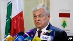 FILE - Russia's special presidential envoy to Syria Alexander Lavrentiev speaks during a press conference.