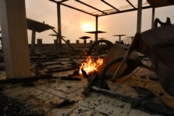 A burned hotel during a wildfire in Lalas village, near Olympia town, western Greece, Aug. 5, 2021. Wildfires rekindled outside Athens and forced more evacuations around southern Greece as weather worsened.