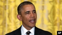 FILE - President Barack Obama speaks during an reception for the U.S. Conference of Mayors in the East Room of the White House on Jan. 23, 2014.
