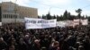 People gather during a protest outside the Greek parliament, in Athens, Greece, March 5, 2023. 