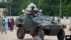 FILE - Nigerian army's armored vehicle in Maiduguri, Nigeria. 