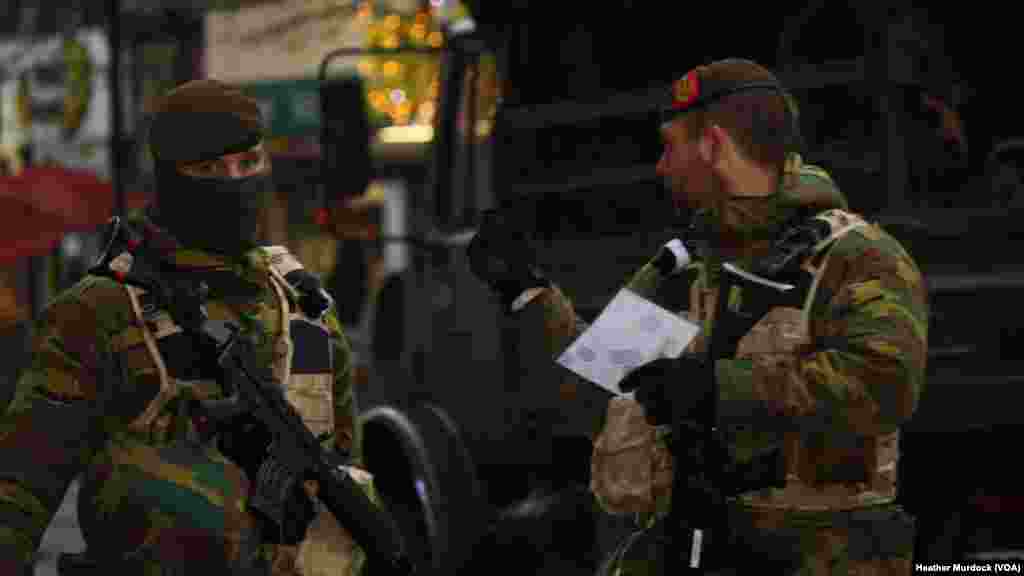 Soldiers are expected to stay on the streets of Brussels throughout the week despite the government's promise of a return to normalcy beginning Wednesday. Photo taken Nov. 24, 2015.